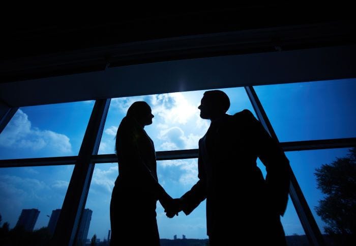 Man and woman shaking hands